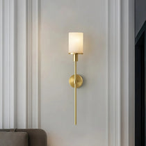 Caldera marble and brass wall sconce mounted on a wall