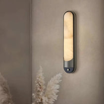 Sandford marble and stainless steel wall sconce in a hallway